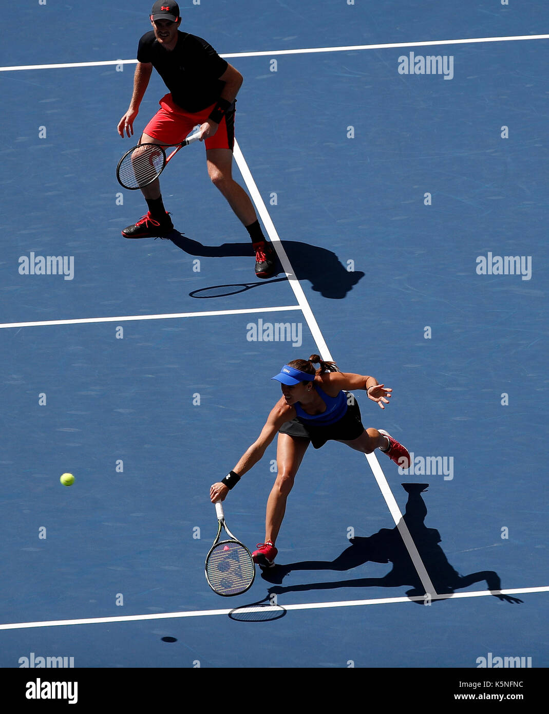 New York, USA. 9th Sep, 2017. Martina Hingis (Bottom) of Switzerland and Jamie Murray of Great Britain compete against Hao-Ching Chan of Chinese Taipei and Michael Venus of New Zealand during the mixed doubles final match at the 2017 US Open in New York, the United States, Sept. 9, 2017. Martina Hingis and Jamie Murray won 2-1 to claim the title. Credit: Qin Lang/Xinhua/Alamy Live News Stock Photo