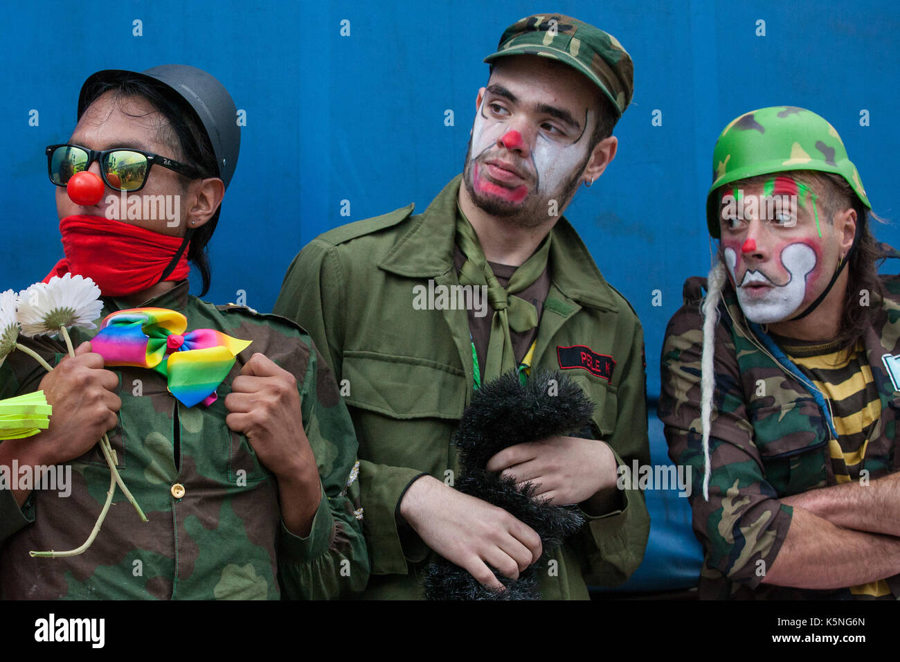 London, UK. 9th September, 2017. The Clandestine Insurgant Rebel Clown Army performs in front of the police and activists from many different campaign and faith groups protesting outside the ExCel Centre against the arms trade and the arms fair to be held at the venue next week. DSEI is the world's largest arms fair and military delegations invited by the British government include states named by the Foreign Office as a 'human rights priority', namely Bahrain, Colombia, Egypt, Pakistan and Saudi Arabia. Credit: Mark Kerrison/Alamy Live News Stock Photo