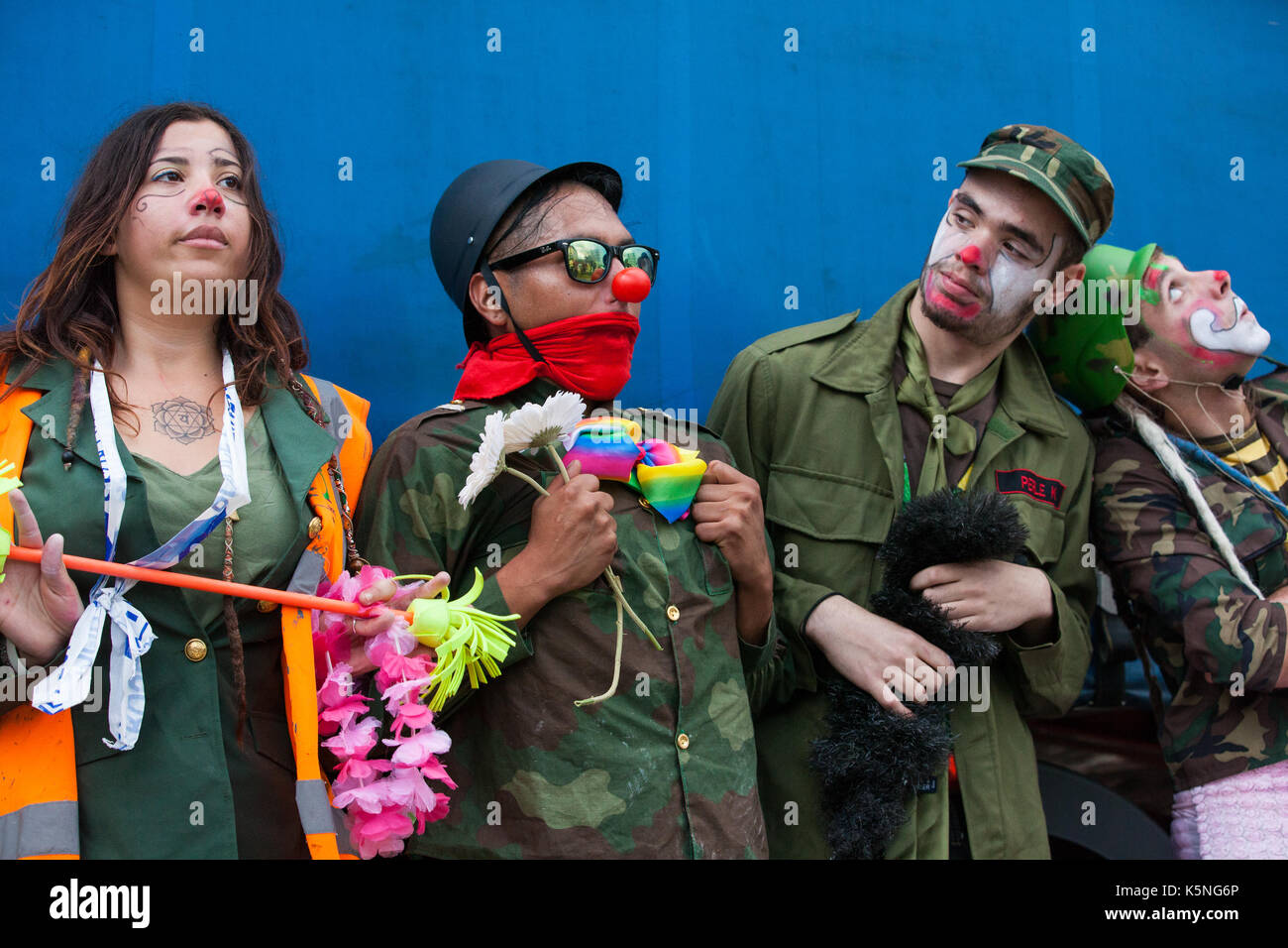 London, UK. 9th September, 2017. The Clandestine Insurgant Rebel Clown Army performs in front of the police and activists from many different campaign and faith groups protesting outside the ExCel Centre against the arms trade and the arms fair to be held at the venue next week. DSEI is the world's largest arms fair and military delegations invited by the British government include states named by the Foreign Office as a 'human rights priority', namely Bahrain, Colombia, Egypt, Pakistan and Saudi Arabia. Credit: Mark Kerrison/Alamy Live News Stock Photo