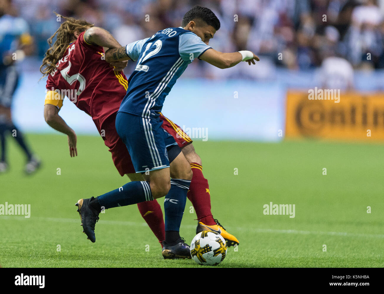 Vancouver, Canada. 9 September 2017. Fredy Montero (12) of Vancouver Whitecaps, fighting Kyle Beckerman (5) of Real Salt Lake, off the ball.  Vancouver defeats Real Salt Lake 3-2.Vancouver Whitecaps vs Real Salt Lake BC Place Stadium.  © Gerry Rousseau/Alamy Live News Stock Photo