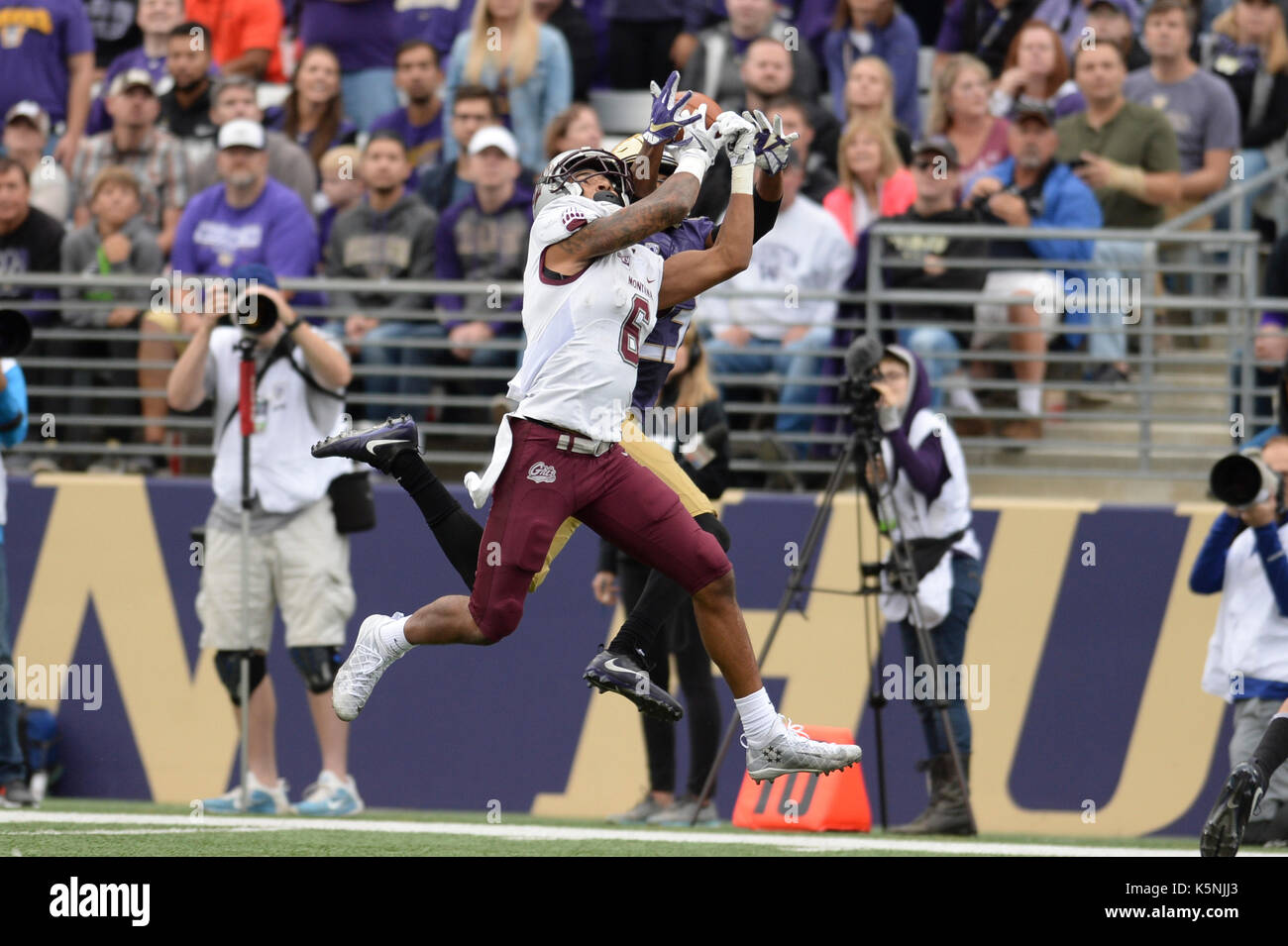 Seattle, WA, USA. 9th Sep, 2017. UW defender Jordan Miller (23) and Montana receiver Keenan Curran (6) go up for a ball in a game between the Montana Grizzlies and the Washington Huskies in Seattle, WA. Jeff Halstead/CSM/Alamy Live News Stock Photo