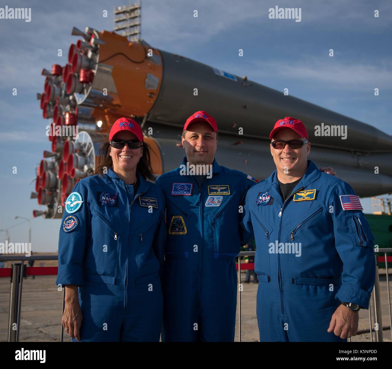 International Space Station Expedition 53 backup crew members Shannon Walker of NASA, left, Anton Shkaplerov of Roscosmos, and Scott Tingle of NASA, right, pose for a group photograph as the Soyuz rocket is rolled out by train to the launch pad at the Baikonur Cosmodrome September 10, 2017 in Baikonur, Kazakhstan. International Space Station Expedition 53 prime crew American astronaut Mark Vande Hei of NASA, Soyuz Commander Alexander Misurkin of Roscosmos, and American astronaut Joe Acaba of NASA will launch aboard the rocket on September 13th. Stock Photo