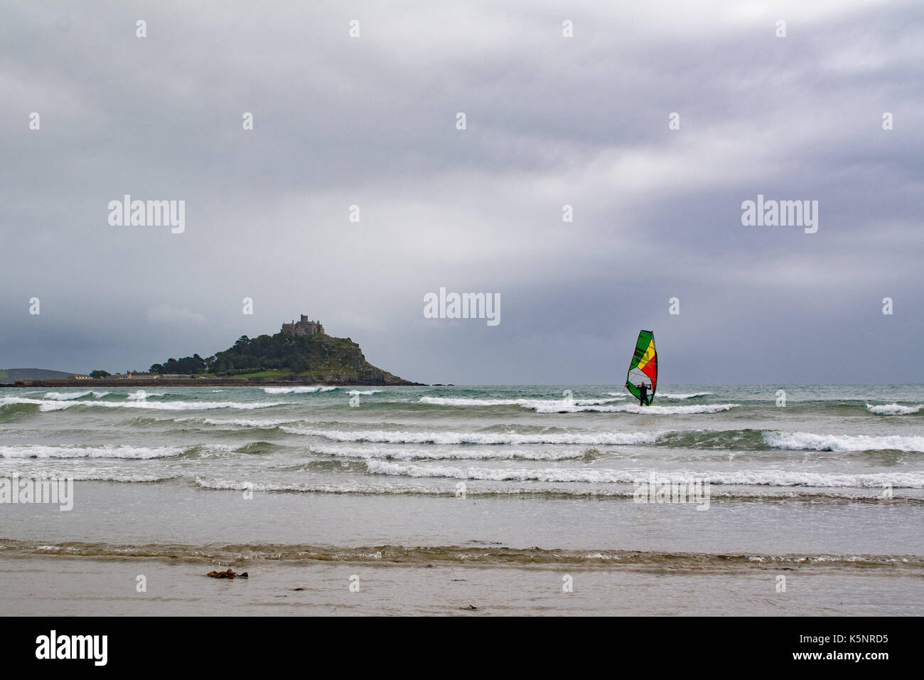 Longrock,  Cornwall, UK. 10th September 2017. UK Weather. The weather was changing rapidly at Longrock near marazion in Cornwall. One minute heavy rain and strong winds, then bright sunshine. Windsurfers were out enjoying the waves and wind. Credit: Simon Maycock/Alamy Live News Stock Photo