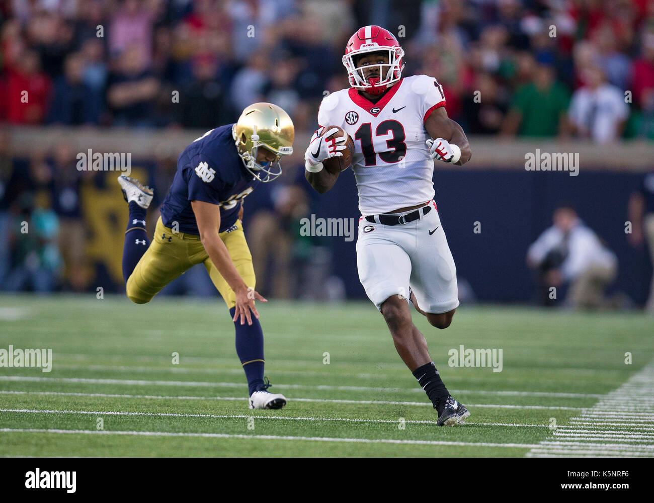 Georgia running back Elijah Holyfield finishes a football drill