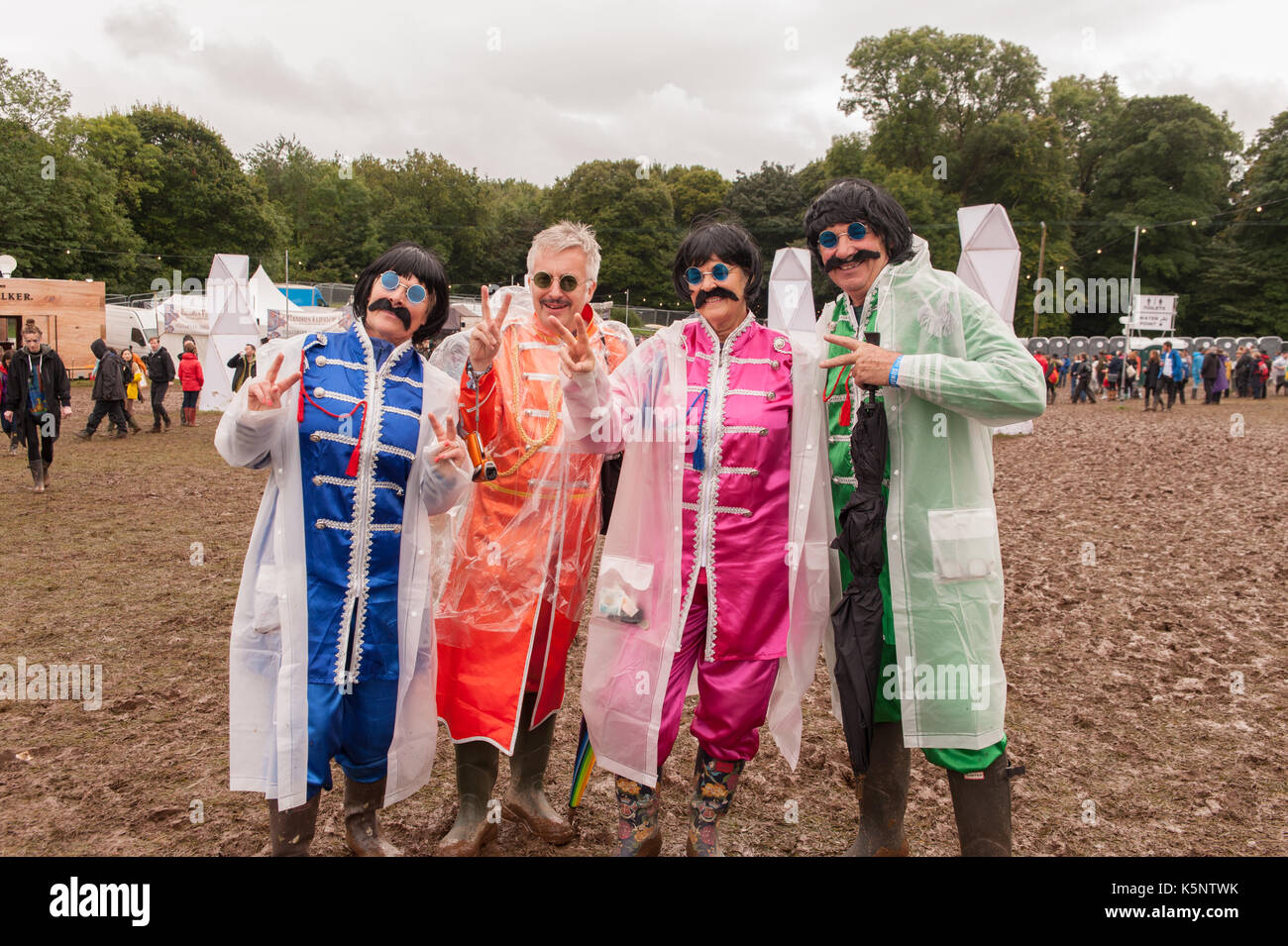 Festival Goers in Fancy Dress brave the muddy conditions at Festival Number 6, Portmeirion, Wales.10th September, 2017. Stock Photo