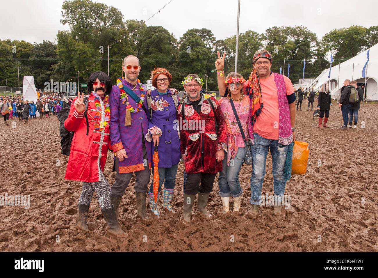 Festival Goers in Fancy Dress brave the muddy conditions at Festival Number 6, Portmeirion, Wales.10th September, 2017. Stock Photo