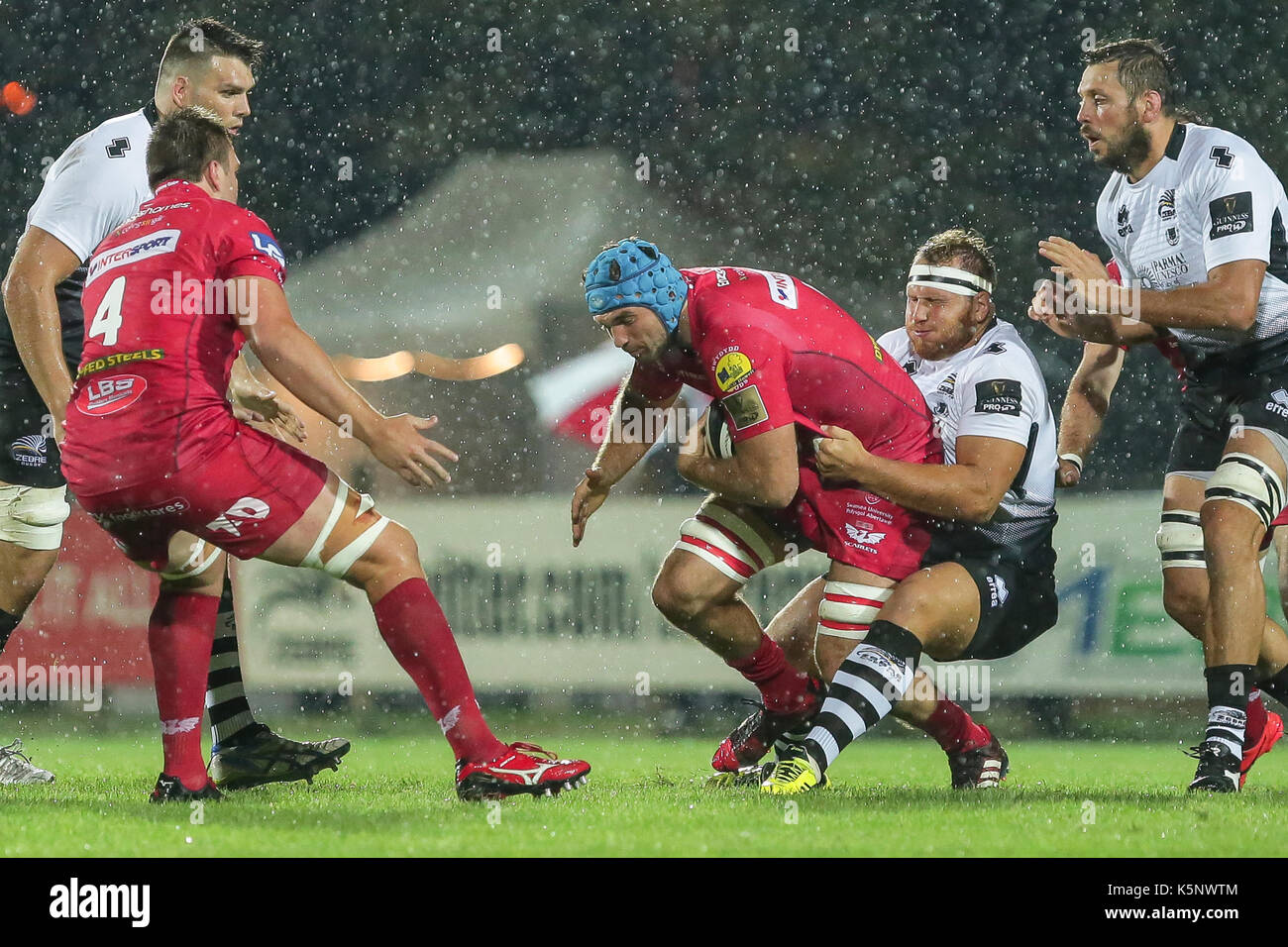 Parma, Italy. 9th September 2017. Zebre's prop Andrea Lovotti tackles David Bulbring in the match against Scarlets in Guinness PRO14 rugby championship. Massimiliano Carnabuci/Alamy Live News Stock Photo