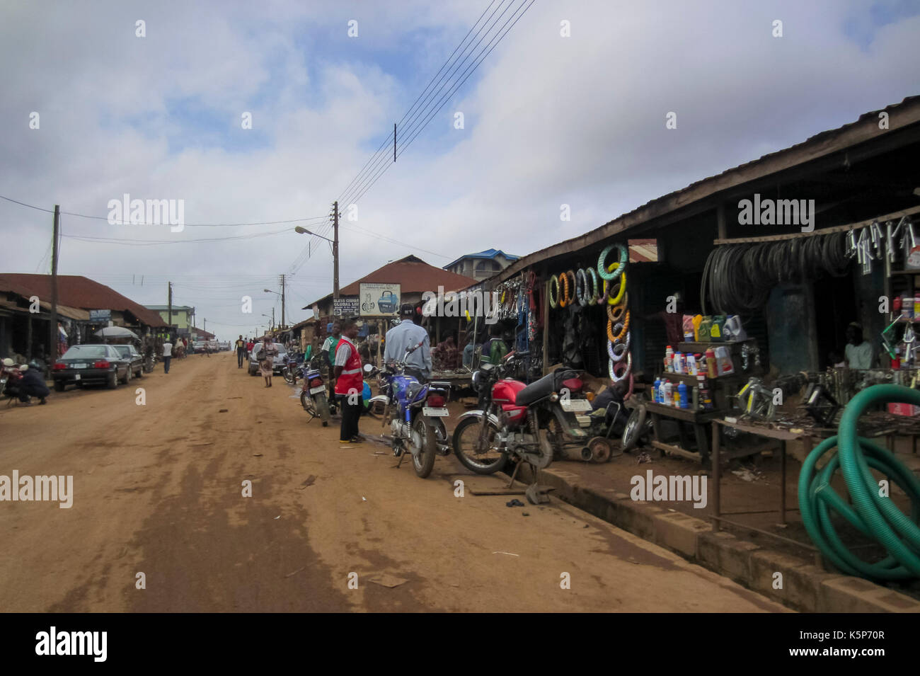 People selling old spare parts for cars and motorbikes in the city of Akure, a big conurbation in Ondo State, Nigeri Stock Photo