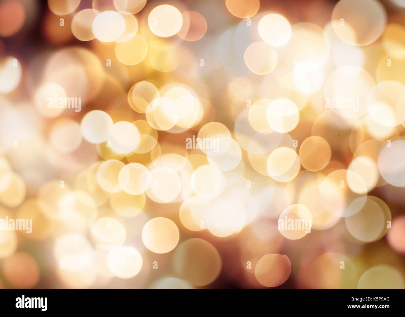 Festive background with natural bokeh and bright golden lights. Vintage ...