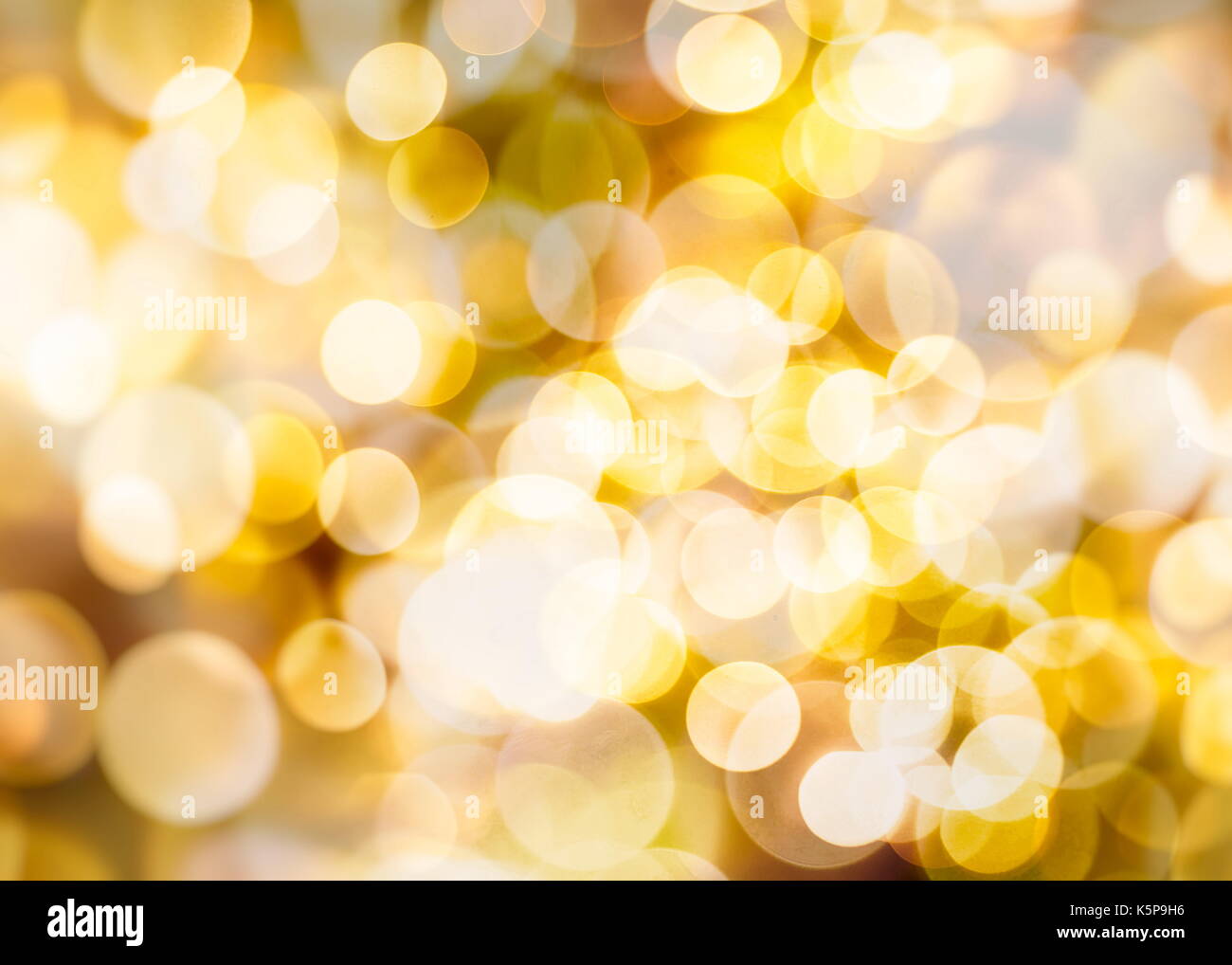 Festive background with natural bokeh and bright golden lights. Vintage ...