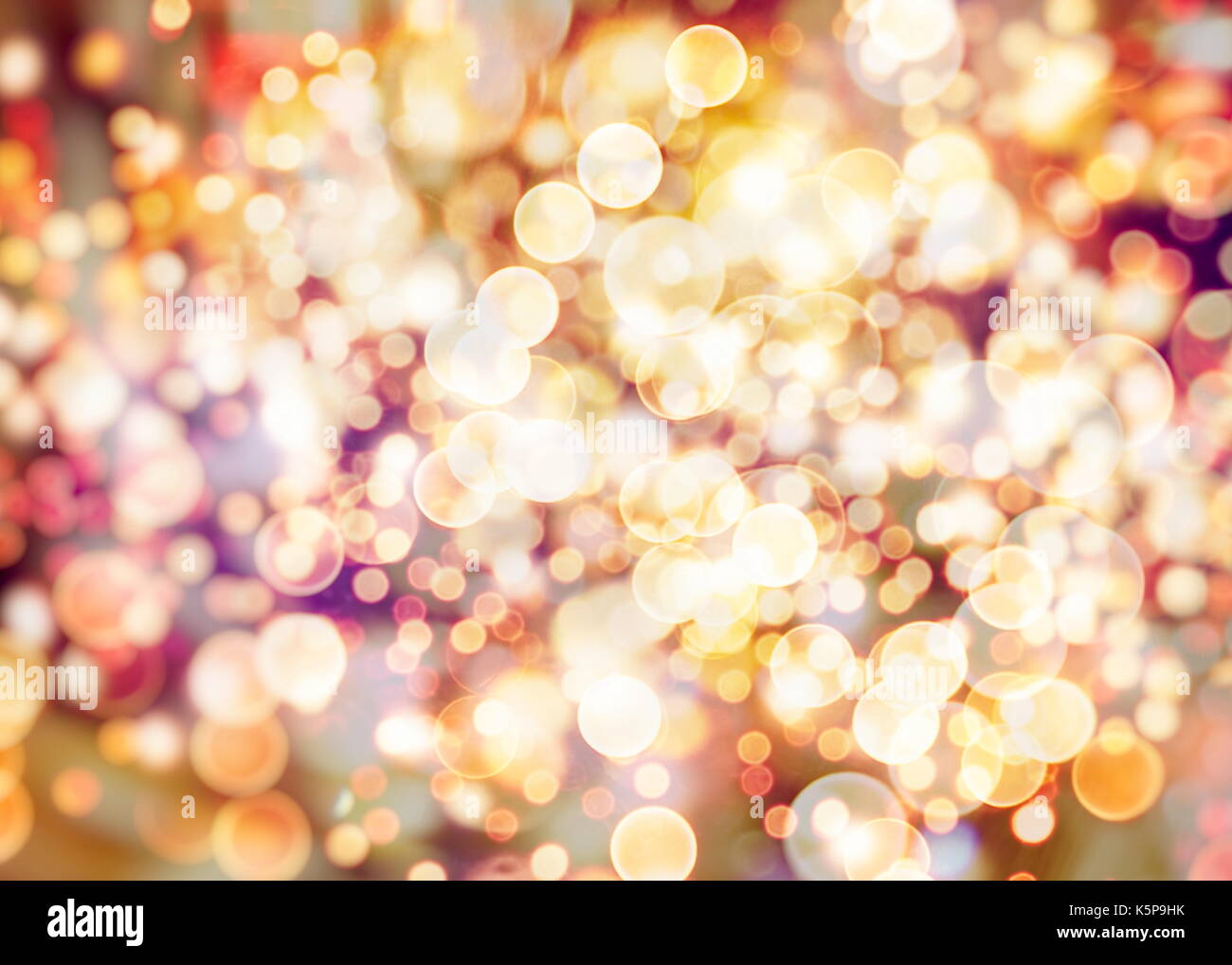 Festive background with natural bokeh and bright golden lights. Vintage ...