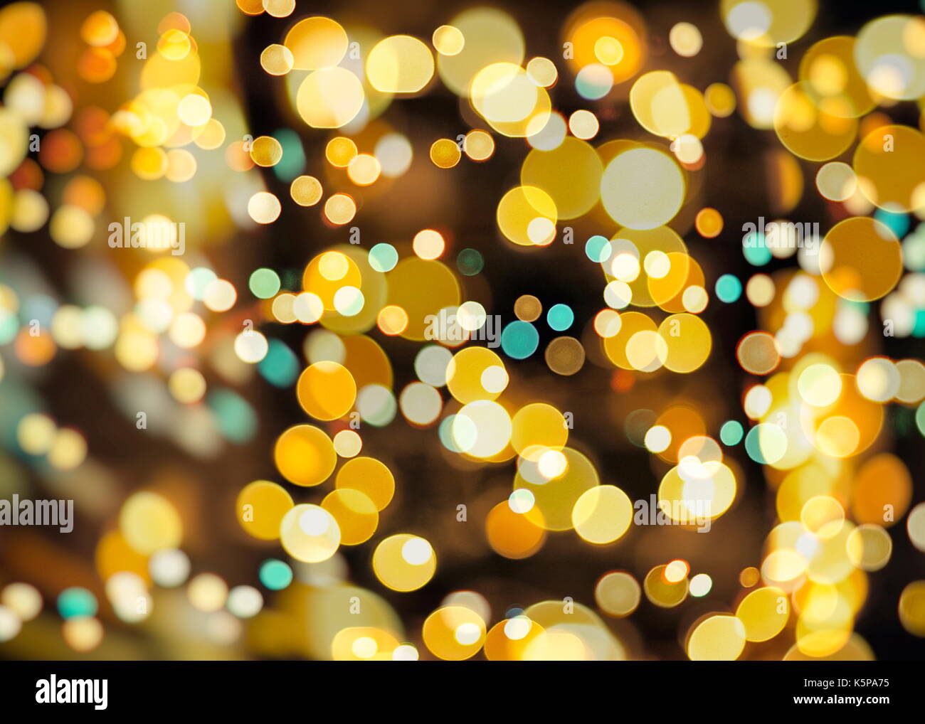 Festive background with natural bokeh and bright golden lights. Vintage ...