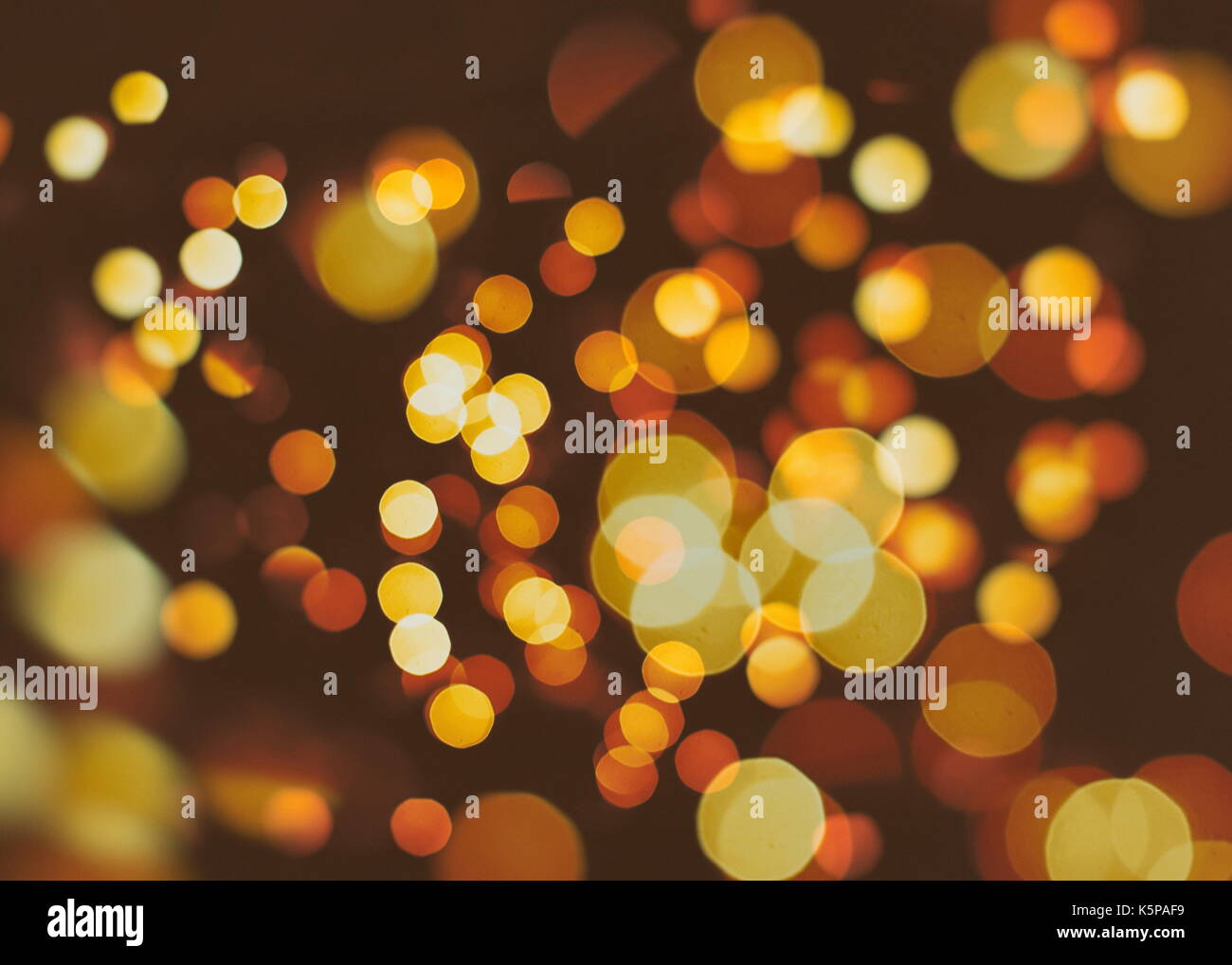 Festive background with natural bokeh and bright golden lights. Vintage ...