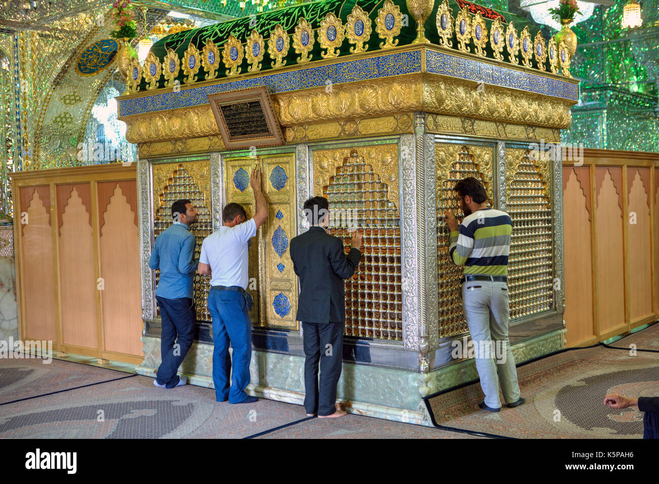 Fars Province, Shiraz, Iran - 18 april, 2017:  Muslims pray in Mosque, Mirrored mausoleum of Sayyed Alaeddin Hossein. Stock Photo
