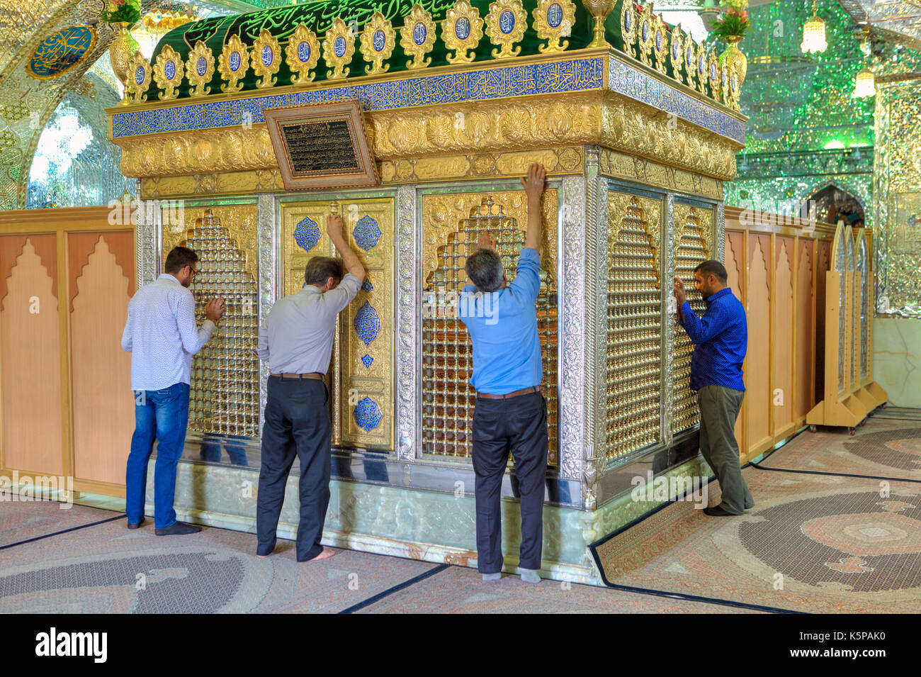 Fars Province, Shiraz, Iran - 18 april, 2017:  Muslims pray in front of Sayyed Alaeddin Hossein tomb, inside Mosque. Stock Photo