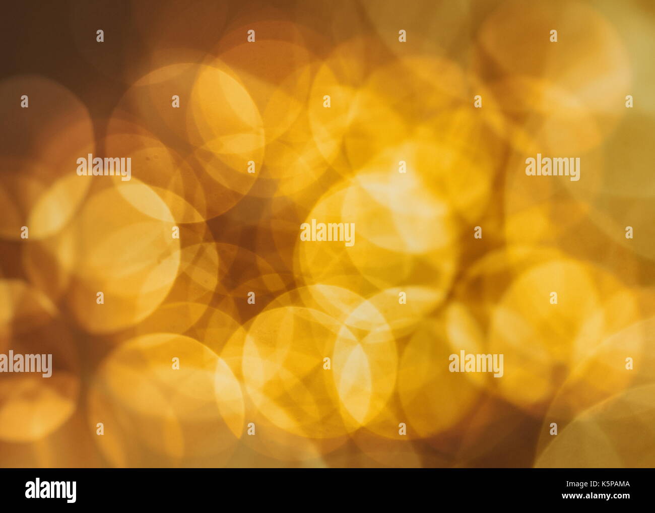 Festive background with natural bokeh and bright golden lights. Vintage ...