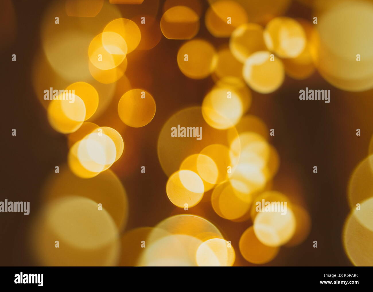 Festive background with natural bokeh and bright golden lights. Vintage ...