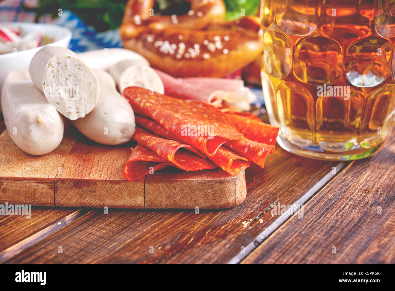 Oktoberfest food on wooden table. Toning. Stock Photo