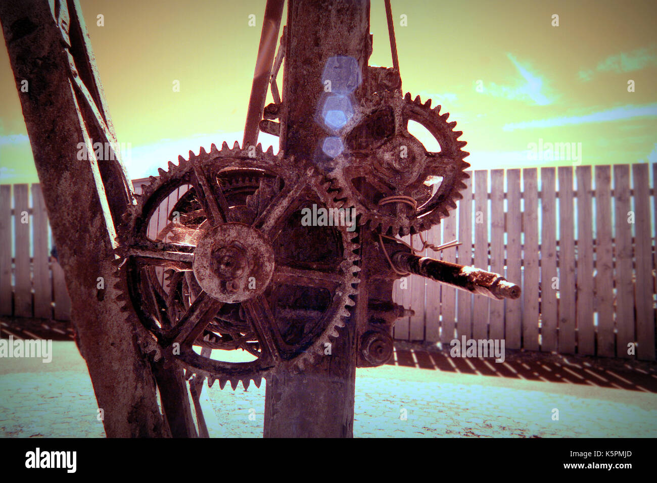 infra red sunny flare generic shot of winch to emphasis cogs and industrial mechanical heritage Stock Photo