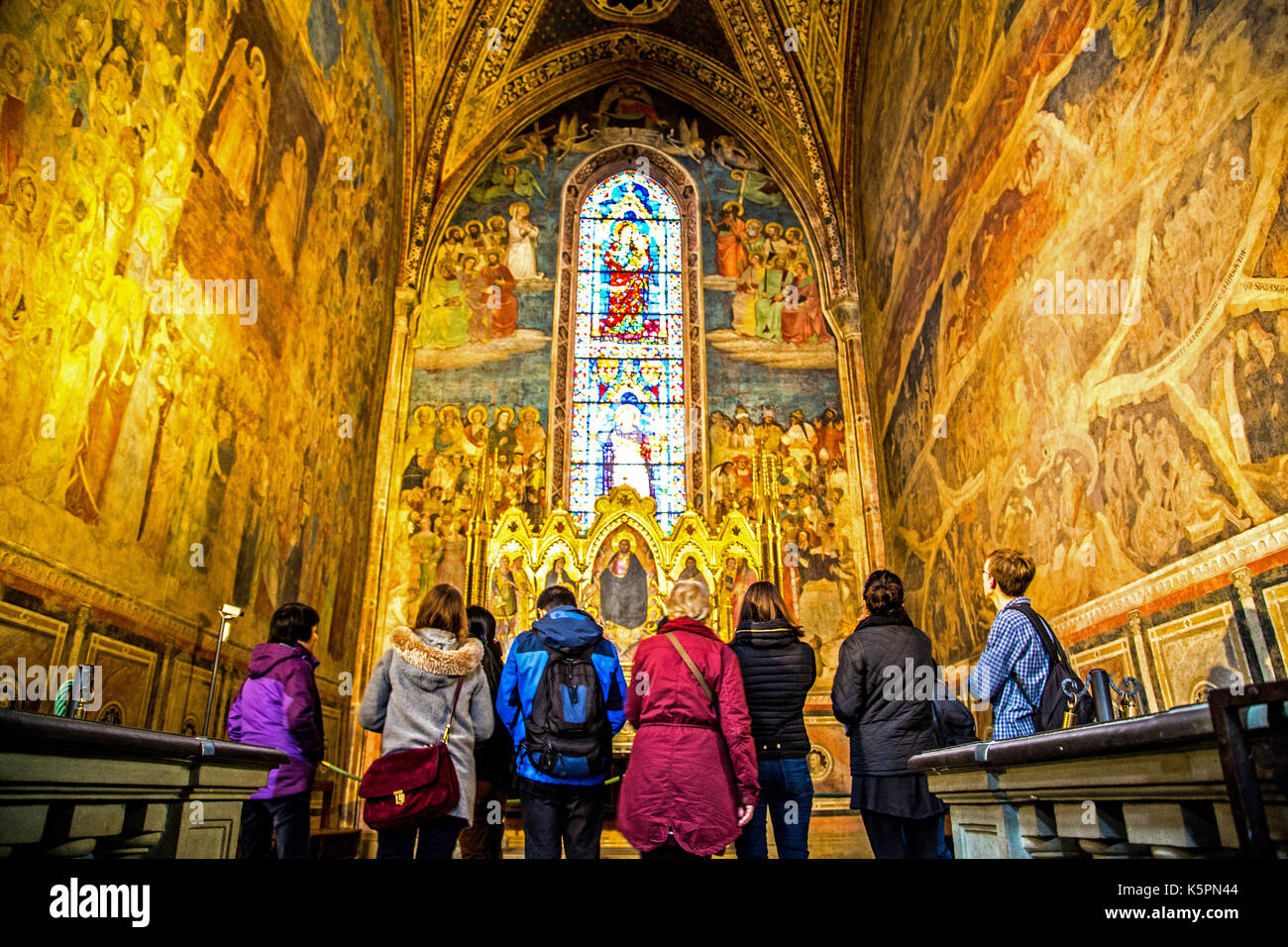 People admiring frescoes in Santa Maria Novella church in Florence Italy Stock Photo