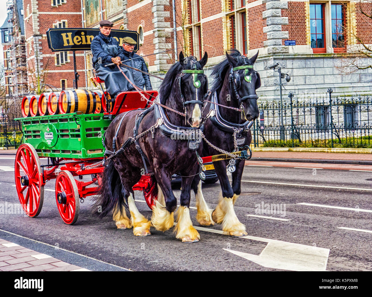 Amsterdam, Netherlands - Mar 25, 2016: Heineken Beer Wagon goes down street Stock Photo