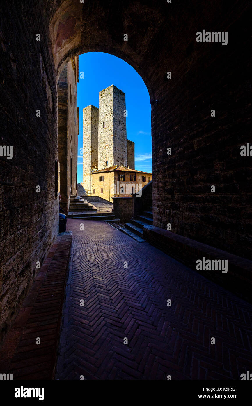 One of the towers of the medieval town, seen through a gate Stock Photo ...