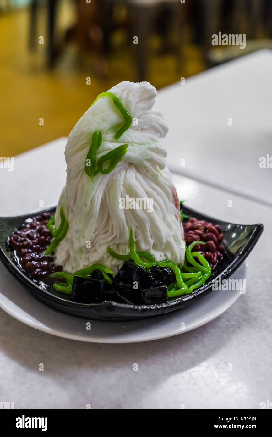 Traditional Singapore cold dessert called Chendol, served with coconut