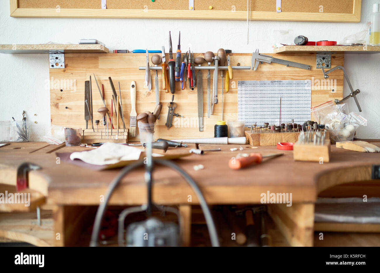 Background image of wooden workstation table in workshop with tools for