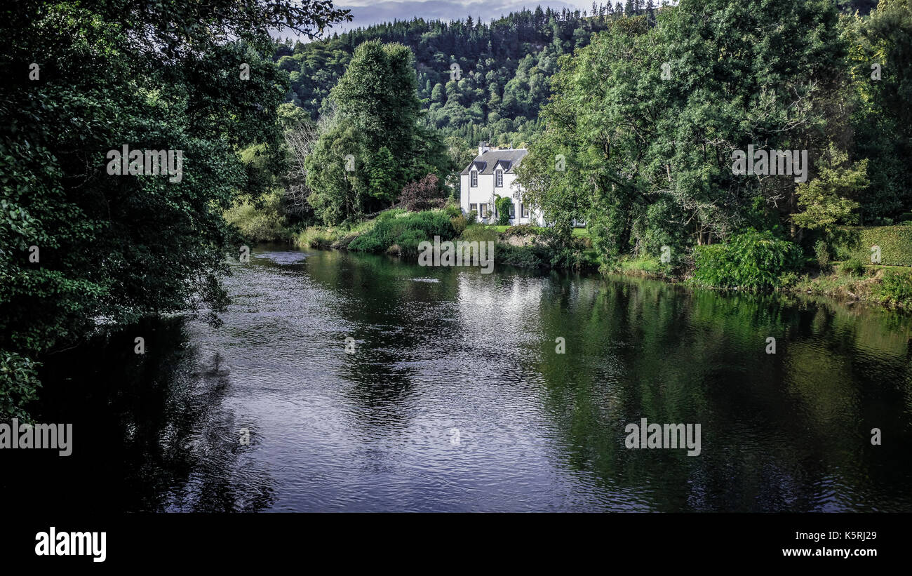 White house by the River Teith in Callander, Perthshire, near Stirling at Loch Lomond and the Trossachs National Park in Scotland Stock Photo
