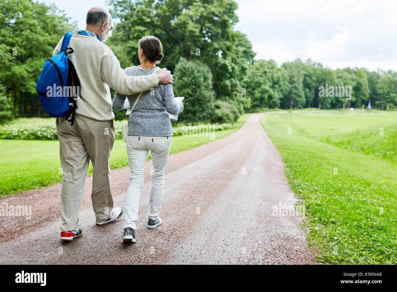 Walking down country road Stock Photo