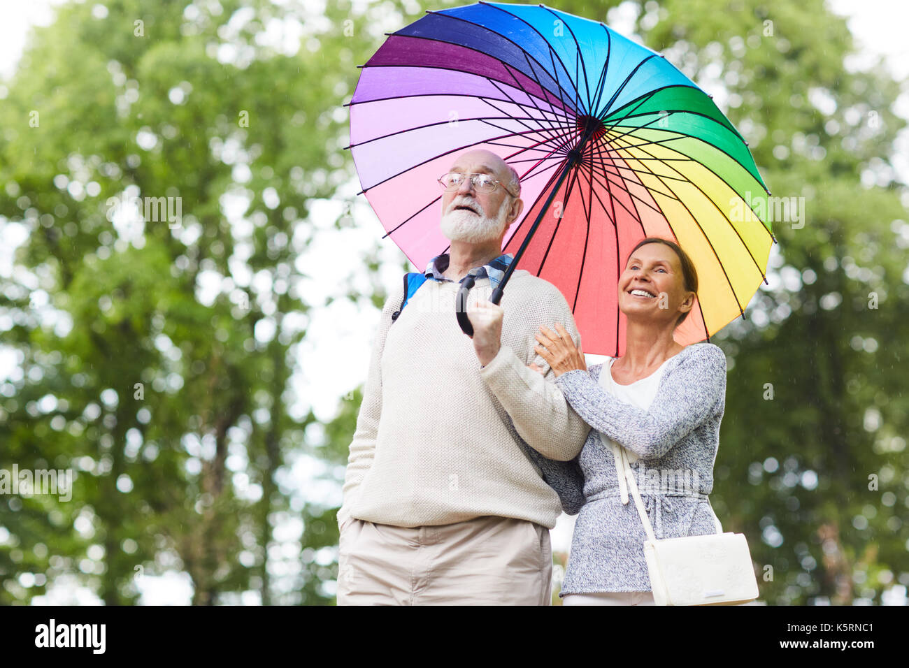 Man and woman under umbrella hi-res stock photography and images - Alamy