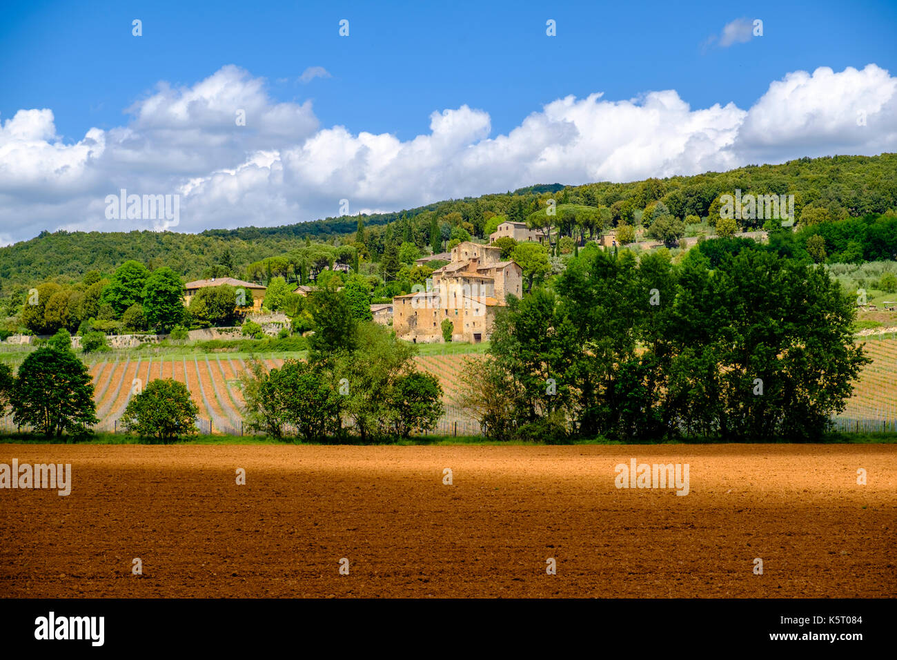The stone houses of the small village are located at the slope of a ...