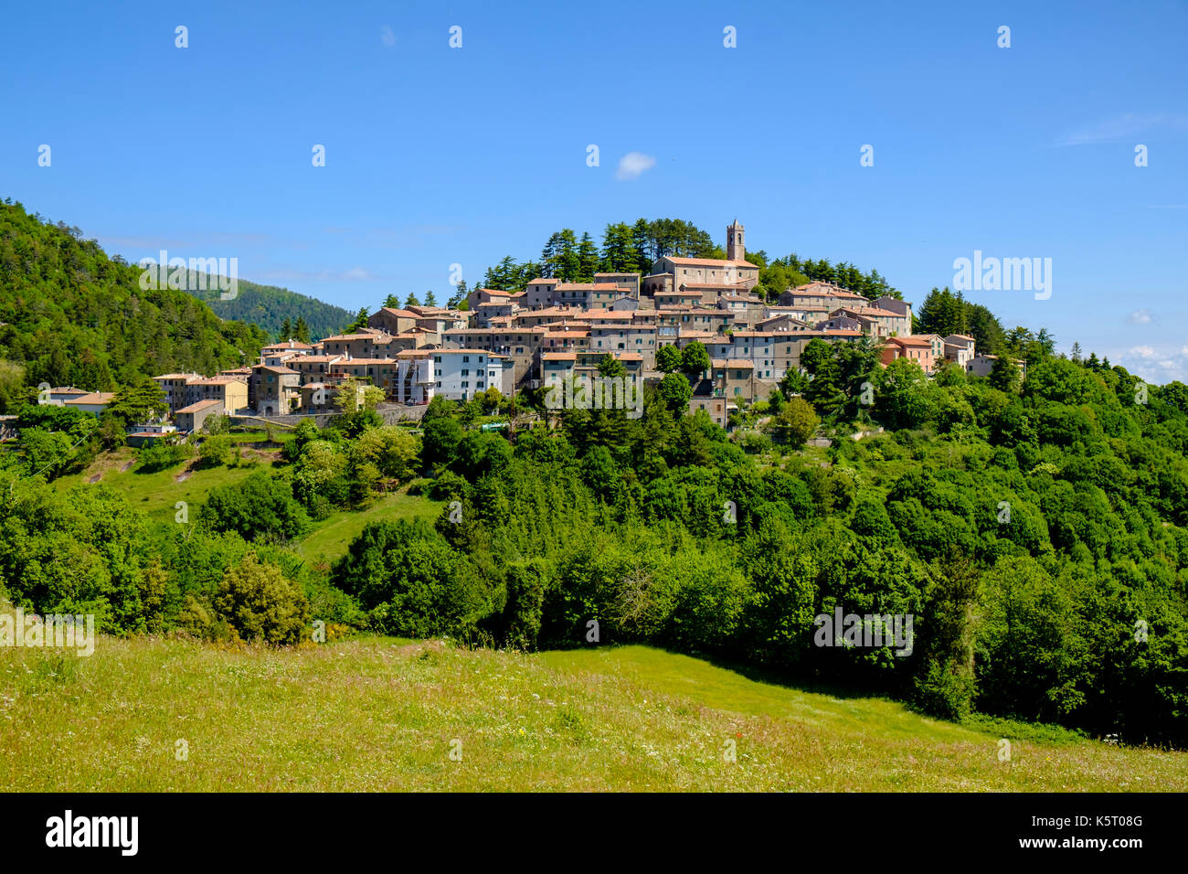 The stone houses of the small village are located on top of a hill ...