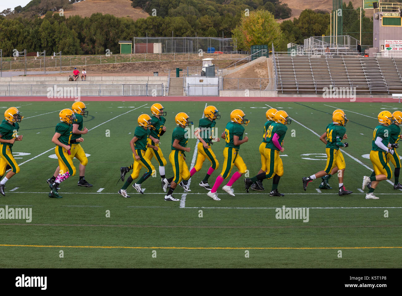 San Marin High School Mustangs, high school football players, exercising before game, high school football game, Novato, Marin County, California Stock Photo