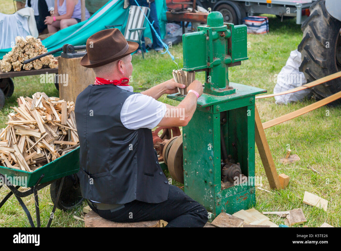 A vintage firewood chopping machine at the Sedgemoor Vintage Rally, Pawlett, Somerset, England, UK Stock Photo