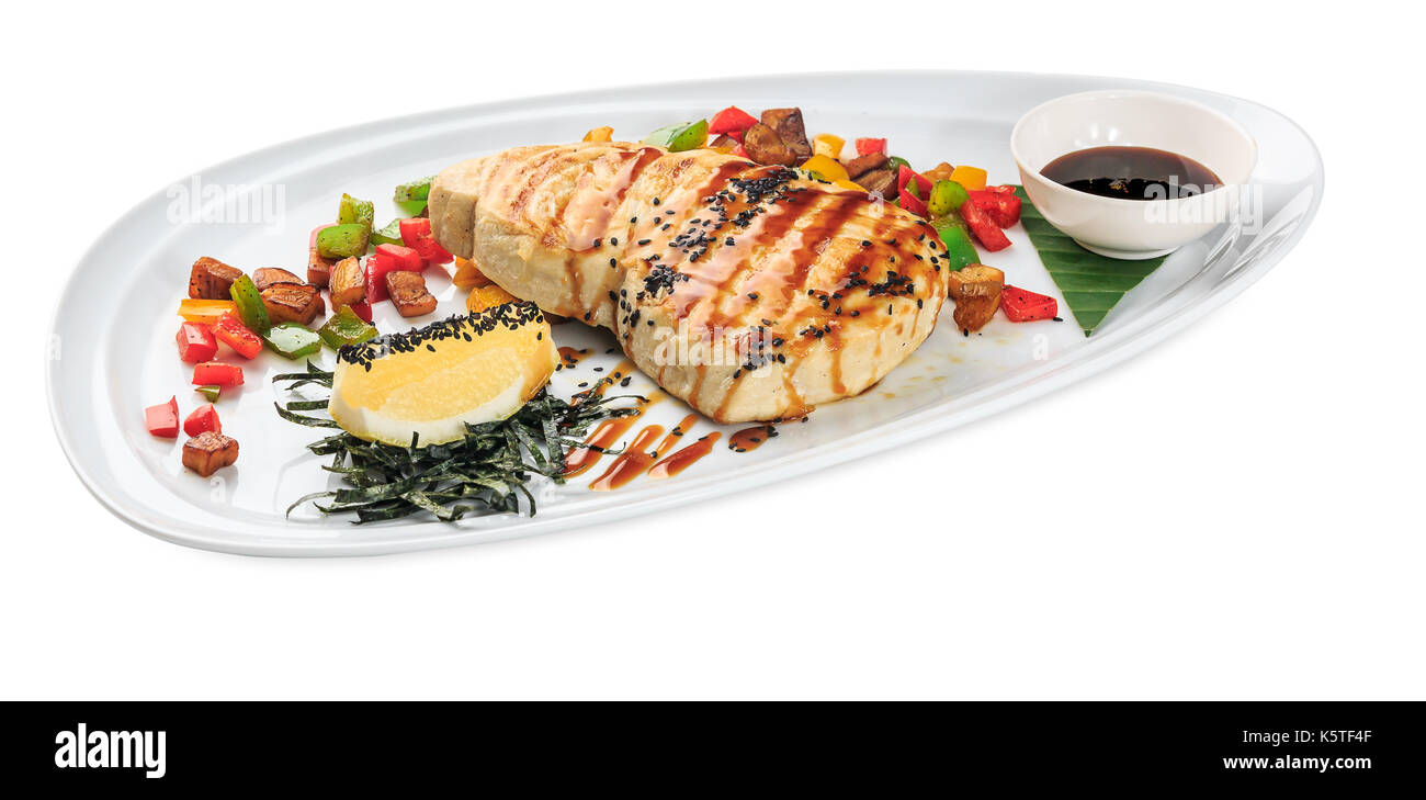Sword Fish Steak - Grilled Swordfish plate - isolated on white background. Studio Shot Stock Photo