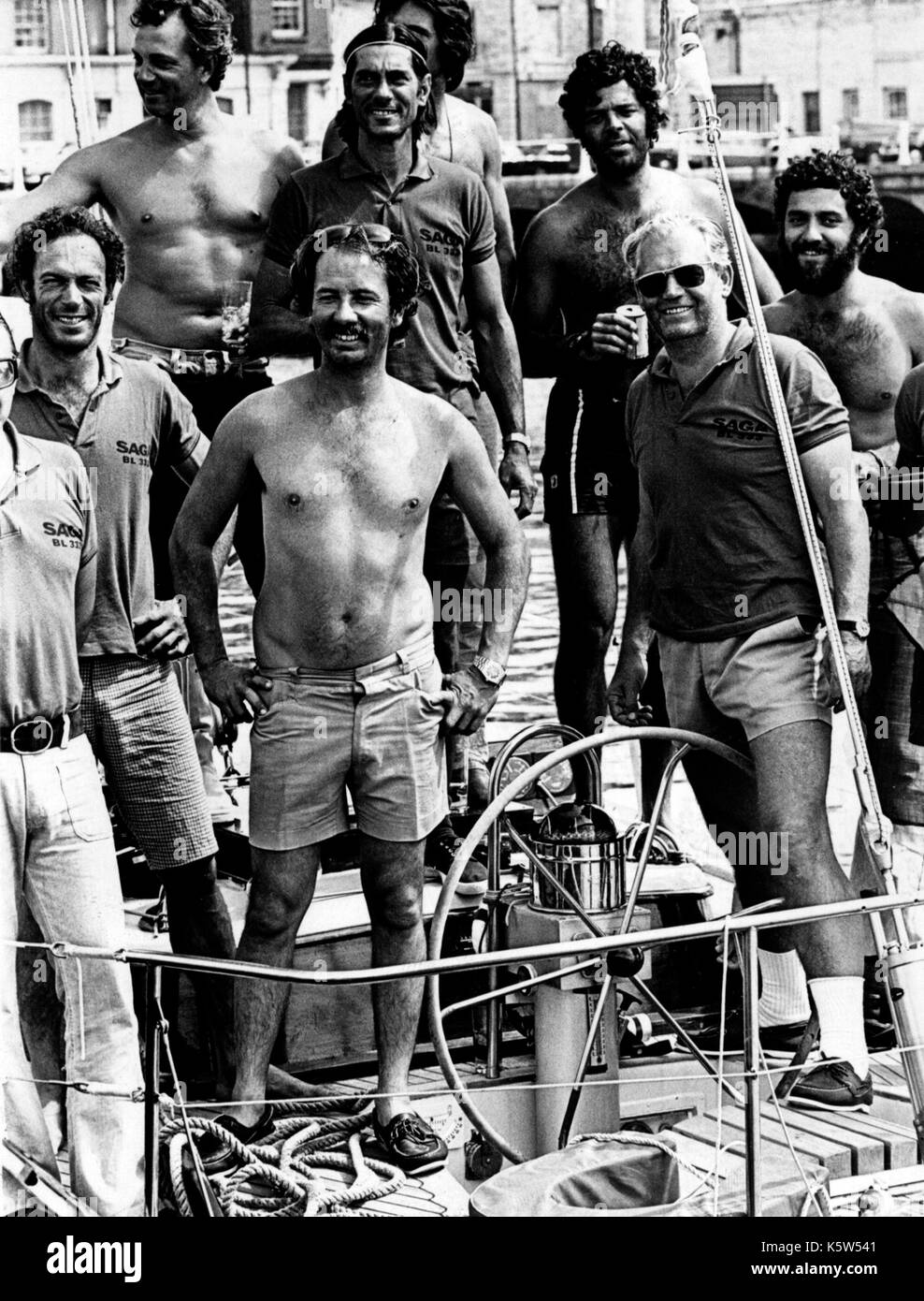 AJAXNETPHOTO. 13TH AUGUST, 1973. PLYMOUTH, ENGLAND. - ADMIRAL'S CUP - CREW OF THE BRAZILIAN TEAM YACHT SAGA IN JUBILANT MOD AS THEIR YACHT DOCKED AT THE END OF THE 605 MILE OFFSHORE YACHT RACE.  PHOTO:JONATHAN EASTLAND/AJAX REF:SAGA CREW 731308 Stock Photo