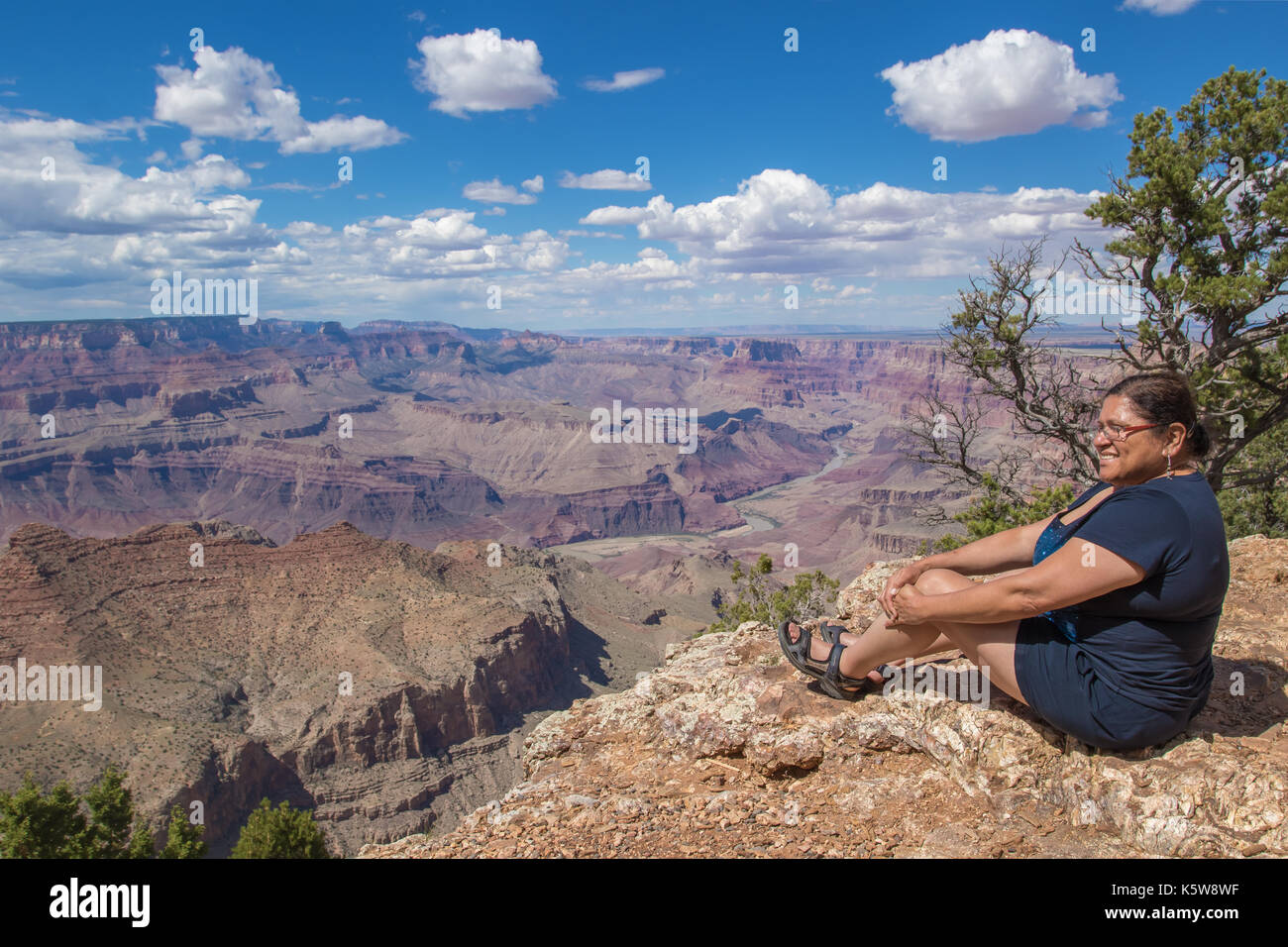 Asian woman enjoying the view on the south rim of the Grand Canyon ...