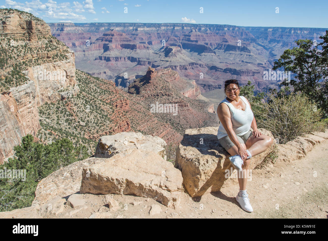 Asian woman proudly posing on the Bright Angel Trail, Grand Canyon ...