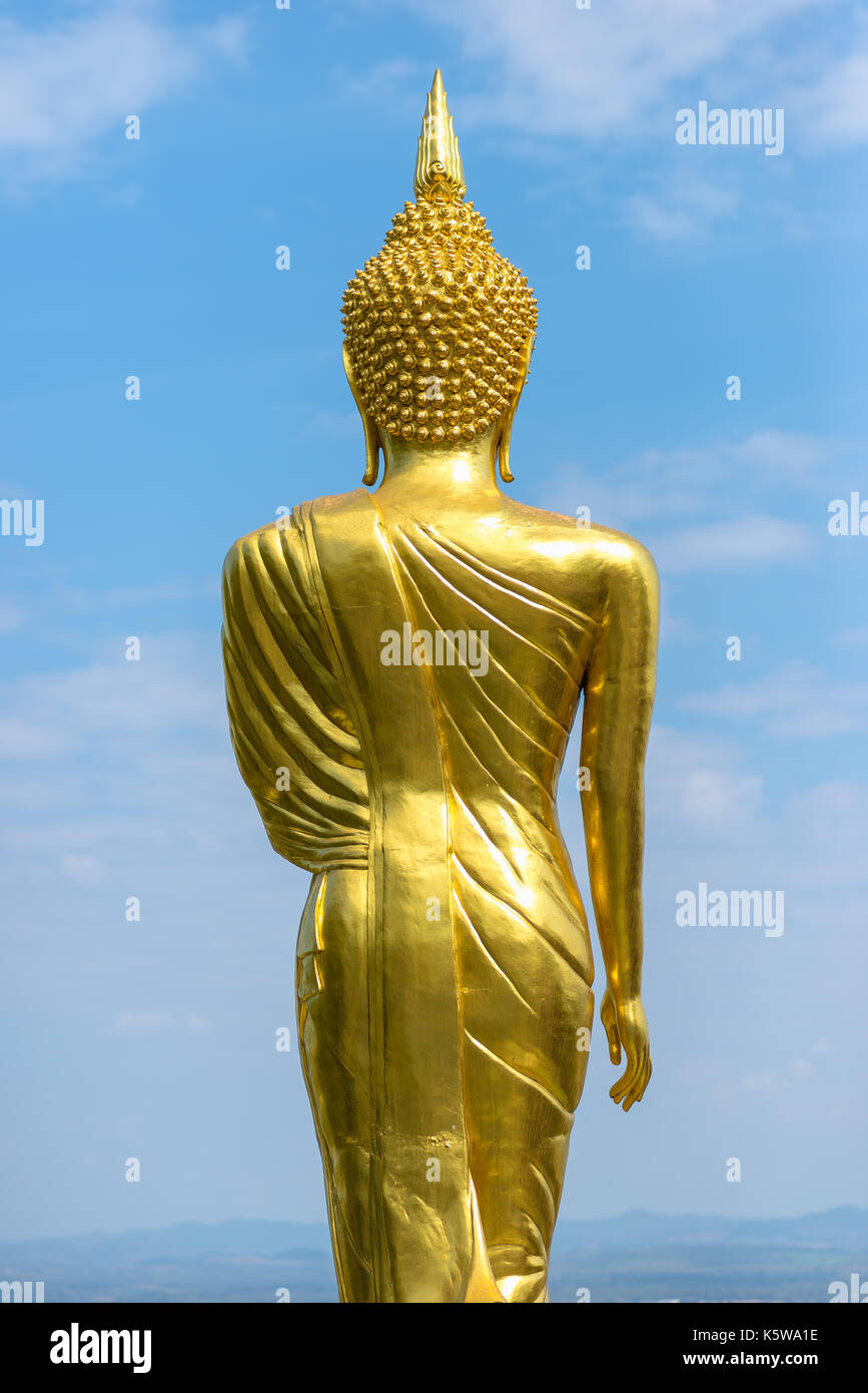 Behind of golden buddha statue with blue sky and cloud Stock Photo - Alamy