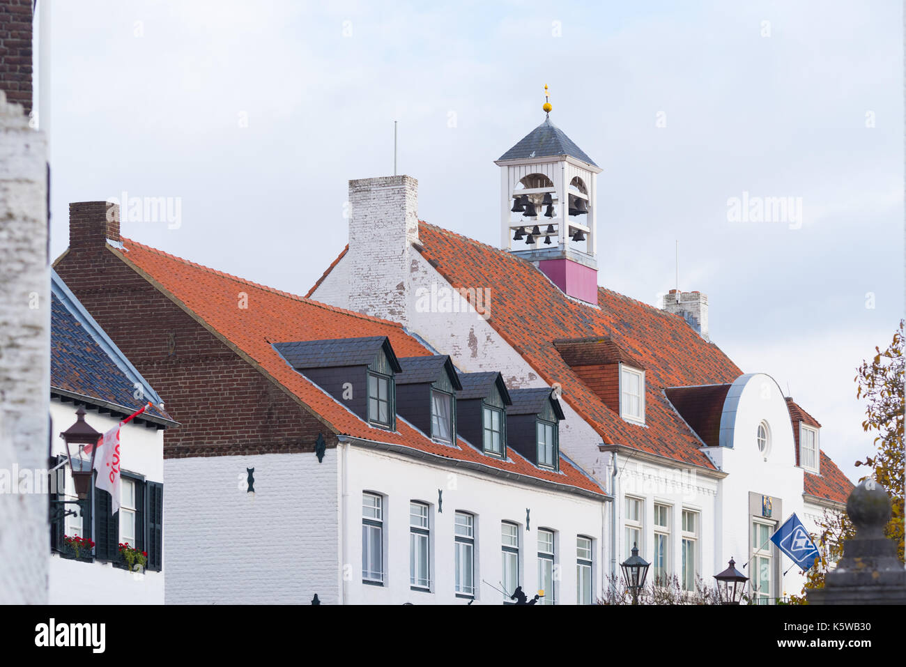 characteristic white church tower in Thorn, the white village, in the southern netherlands Stock Photo