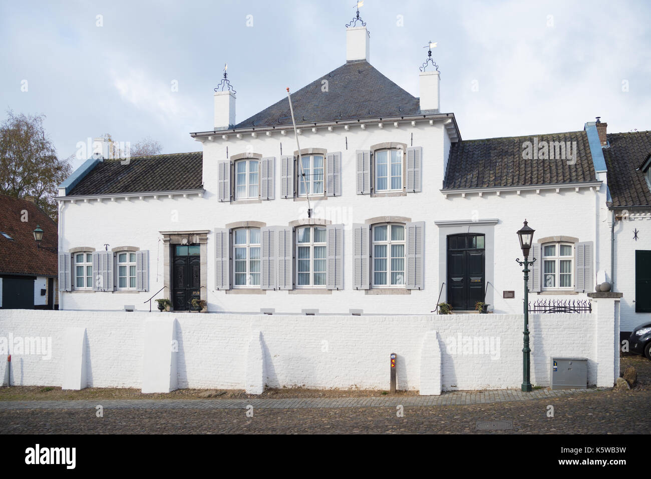 large white building in Thorn, the white village, in the southern Netherlands Stock Photo