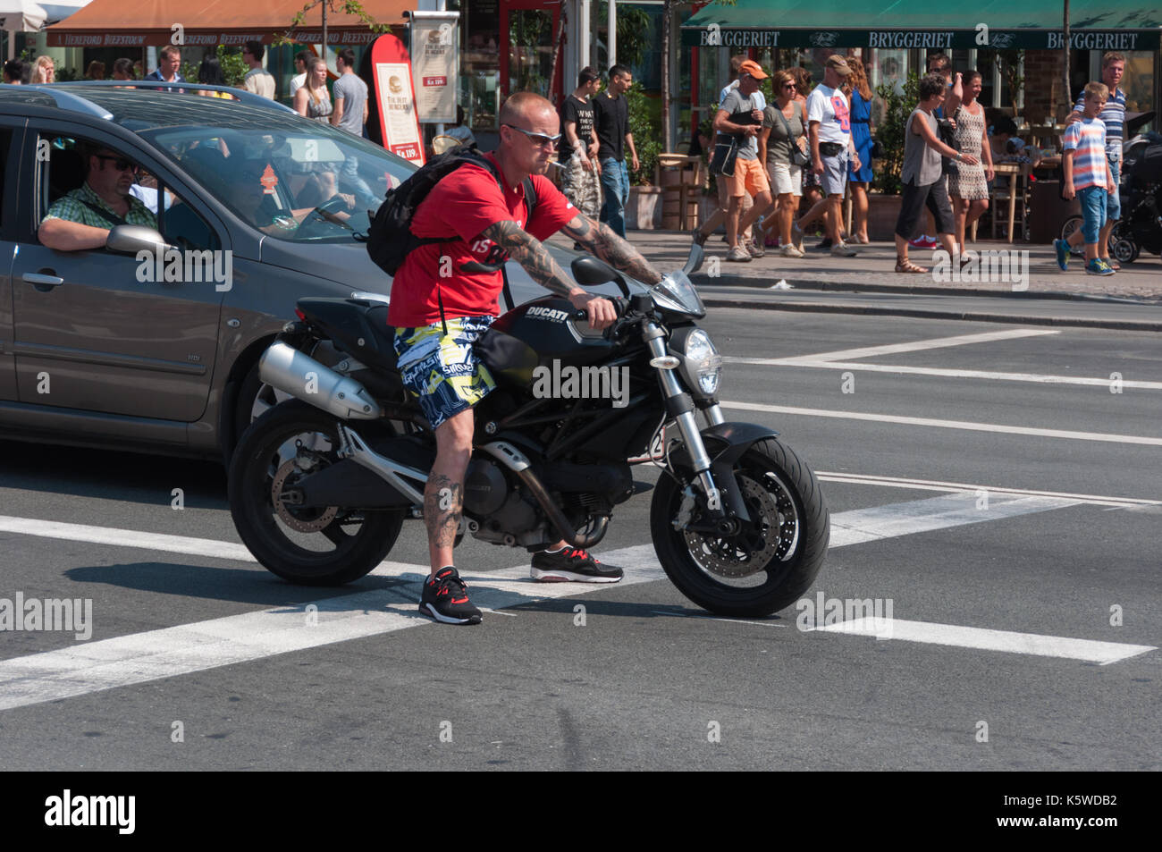 A man on his bike in Copenhagen, Denmark. Stock Photo