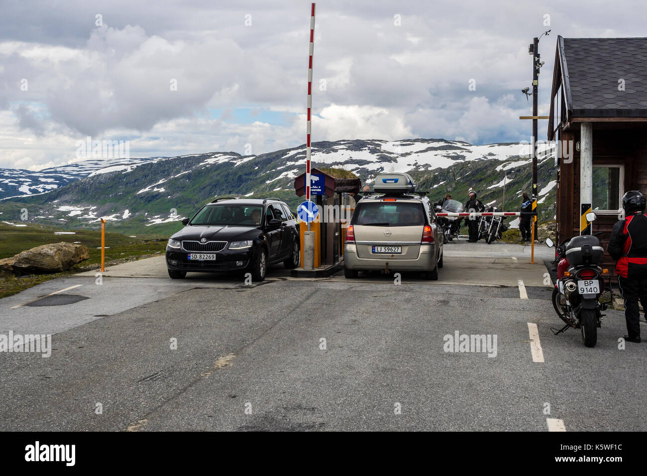 Toll road Tindevegen between  Årdal at the Sognefjord and Turtagrø, cars and motorbikes at the toll booth, western Jotunheimen, Norway Stock Photo