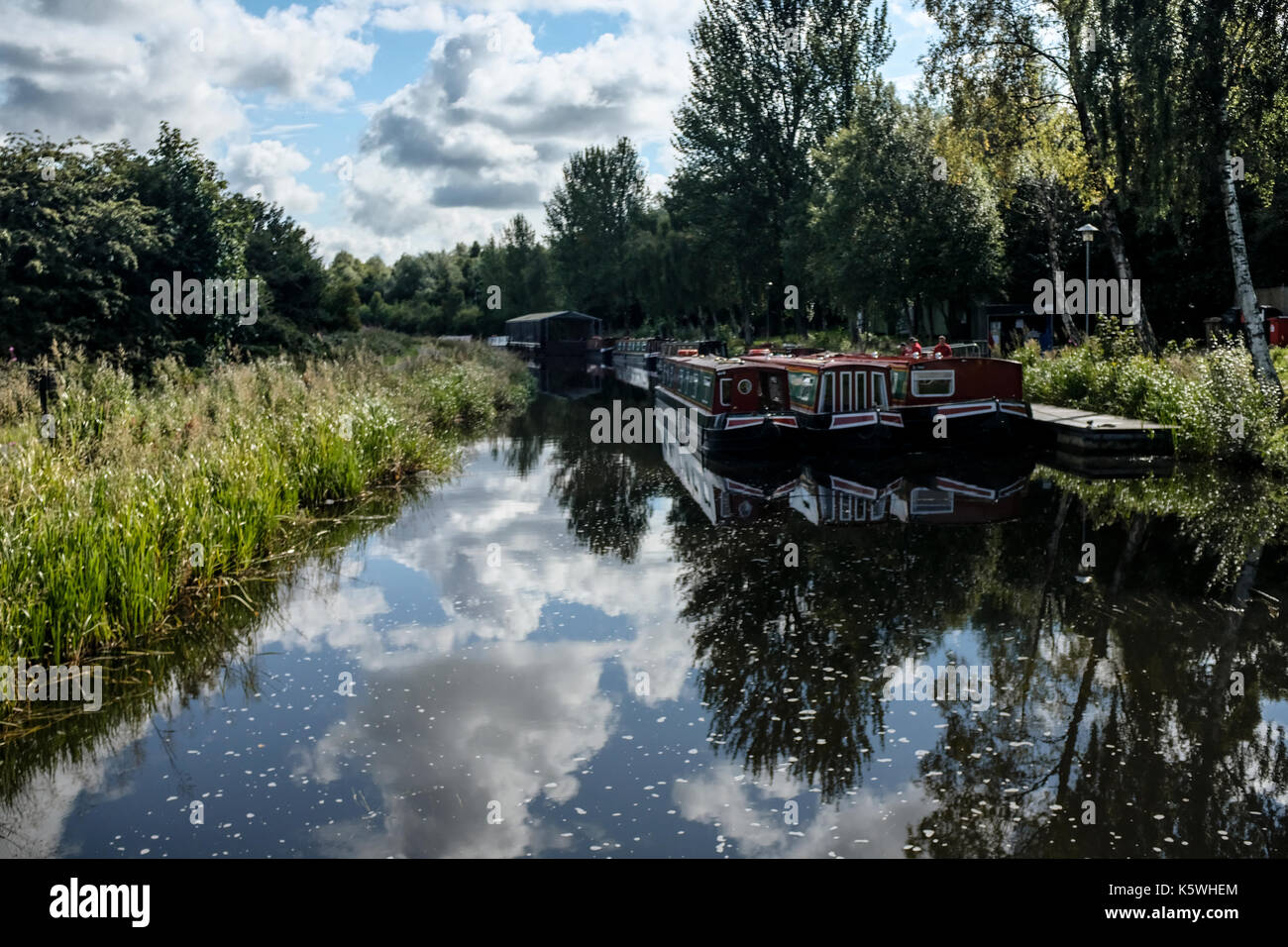 3 Scottish canal boats moored at the jetty near the Falkirk Wheel Visitor's Centre in Scotland Stock Photo