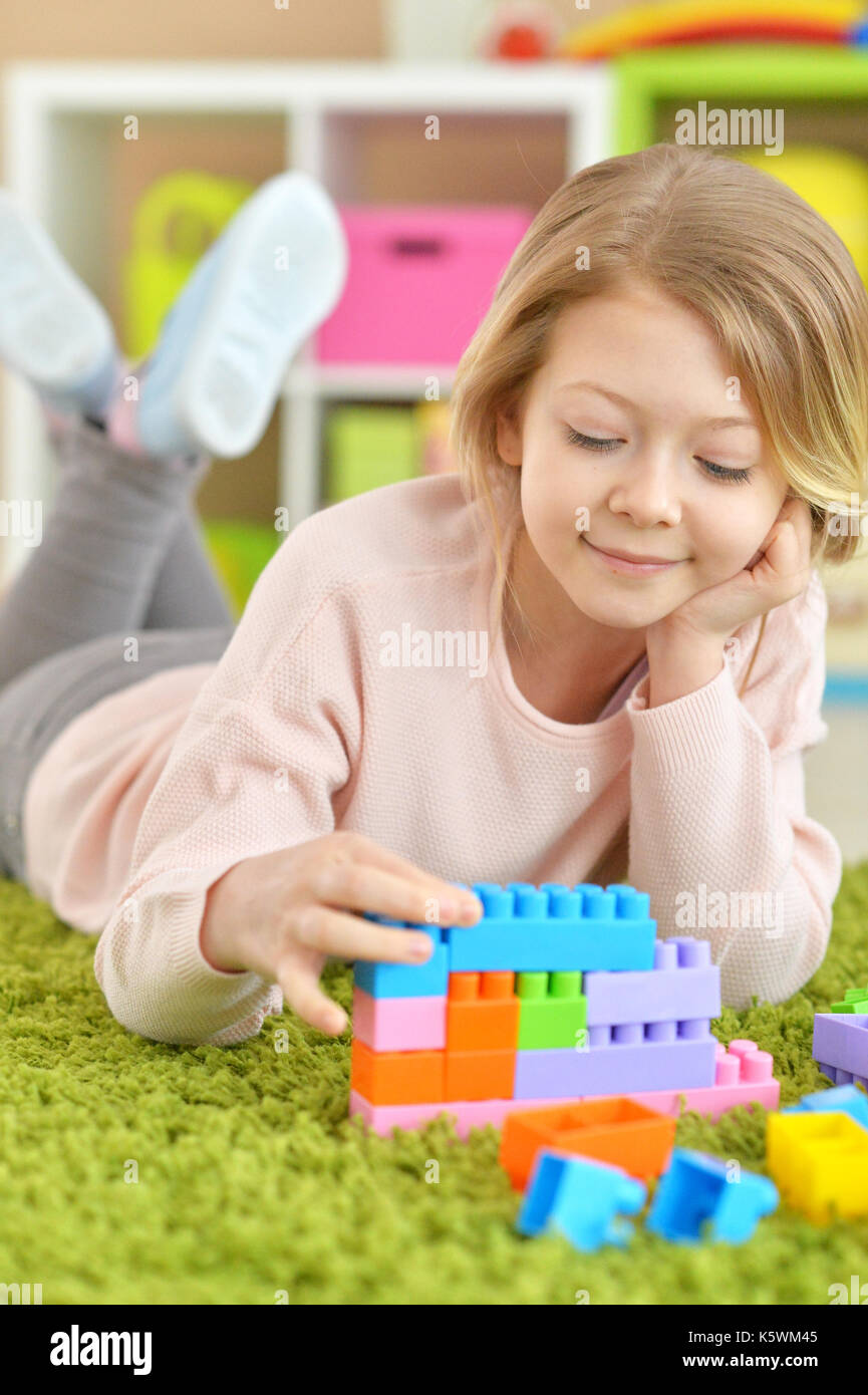 girl playing with plastic blocks Stock Photo - Alamy
