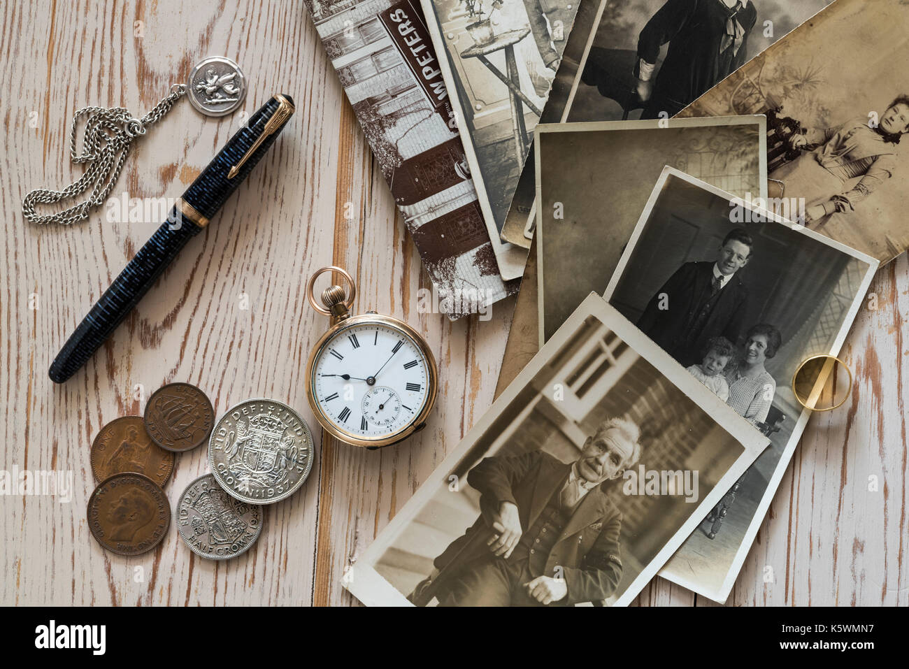 Old family photographs and some collectable items. Nostalgia, memories. Stock Photo
