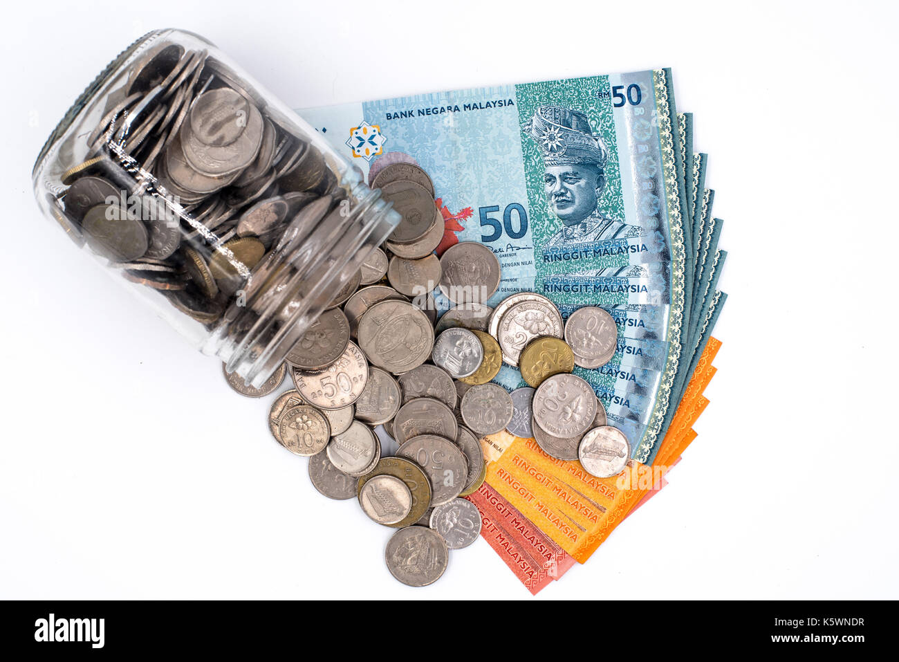 Malaysia Ringgit and coins in a jar Stock Photo - Alamy