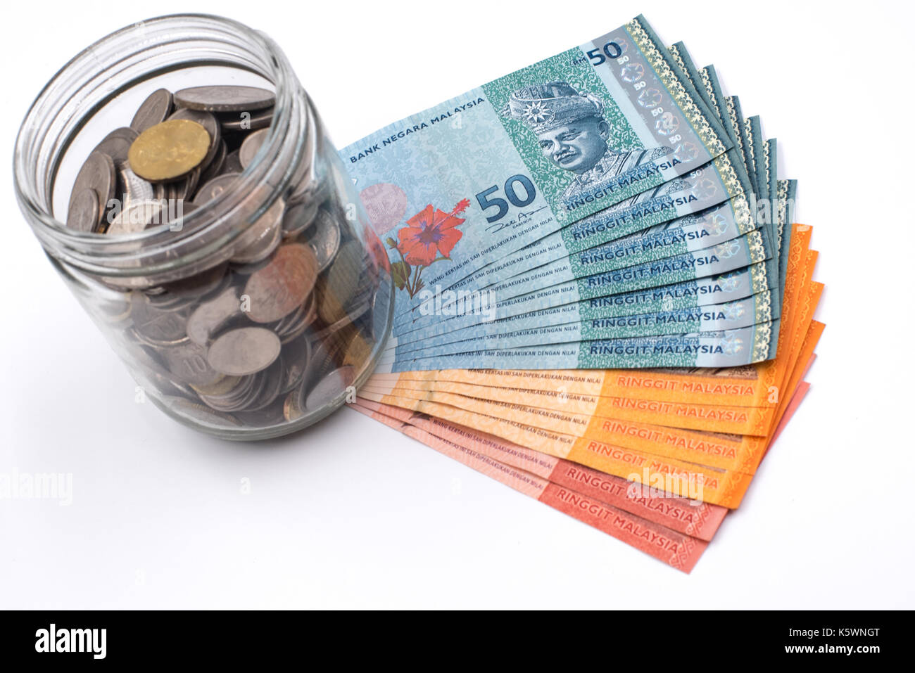 Malaysia Ringgit and coins in a jar Stock Photo - Alamy