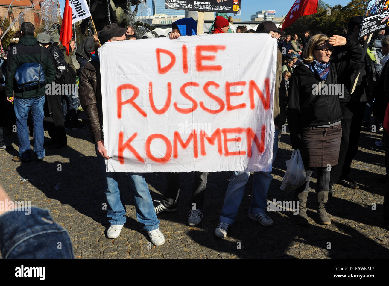 15.10.2011, Berlin, Germany, Europe - Participants at the worldwide protest day against the capitalist crisis in front of the town hall Rotes Rathaus  Stock Photo